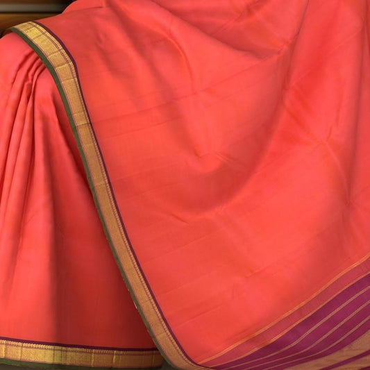 Orange Kanchipuram Silk Saree with Diamond with Mango on the body with Purple contrast border and Seet Mundhi with gatti zari