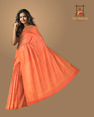 Orange Kanchipuram Silk Saree with Small Butta jackard on the body with zig zag self border and Intricately designed copper zari pallu.