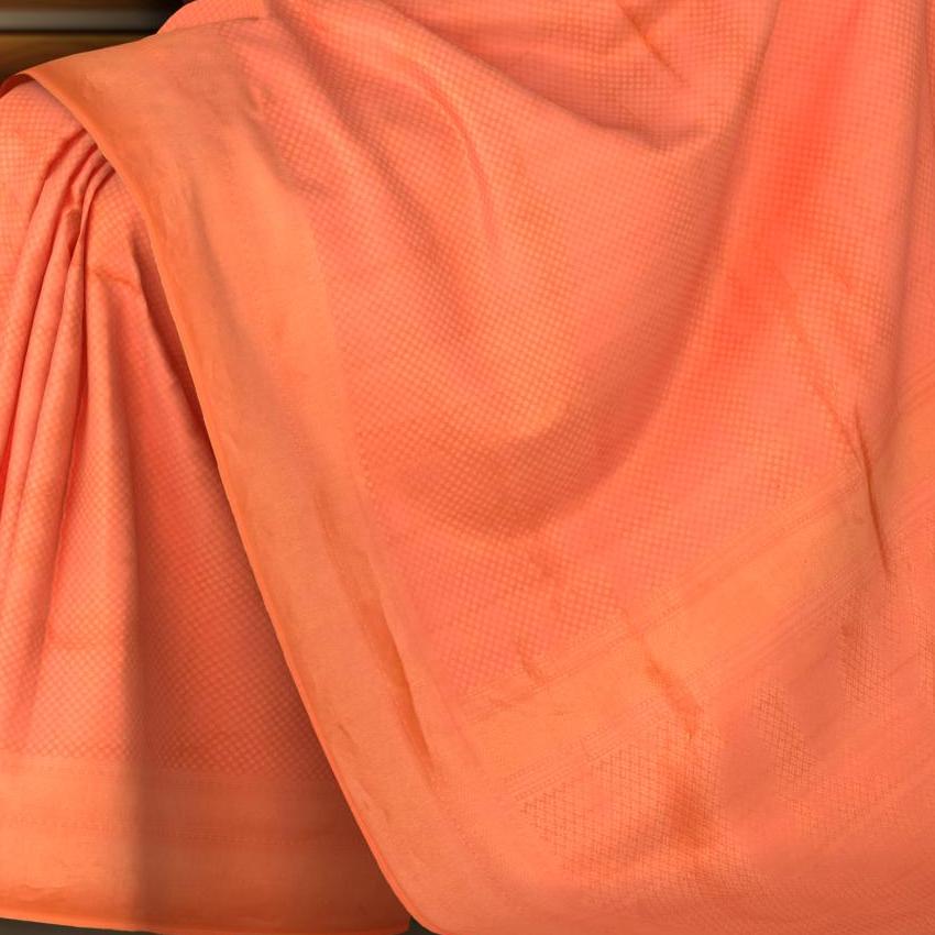 Orange Kanchipuram Silk Saree with Small Butta jackard on the body with zig zag self border and Intricately designed copper zari pallu.