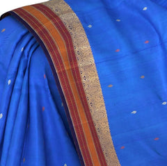 Light Blue Kanchipuram Silk Saree with Woven Butta threadwork on the body with Peacocock threadwork Maroon, mustard self border and Dark Blue with no zari. Intricately woven threadwork in maroon, mustard.