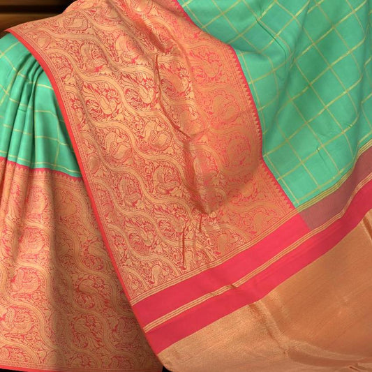 Coral Pink Confluence Pure Kanchipuram Silk Saree with Blue Floral Buttas