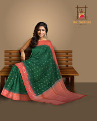 Enchantment in Green with Silver Buttas and Orange Borders Pure Silk Saree