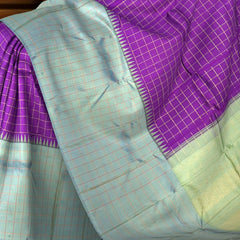 Purple Kanchipuram Silk Saree with Zari Checks and Blue-Grey Border – A Royal Classic with a Contemporary Touch