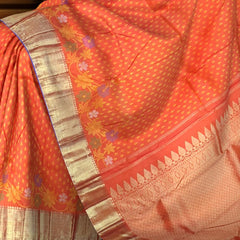 Orange Kanchipuram Silk Saree with Butta Jacquard and Floral Border – A Festive Symphony in Silk