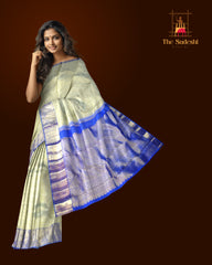 Off-White Kanchipuram Silk Saree with Floral Jacquard and Blue Border – Ethereal Elegance in Every Thread