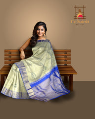 Off-White Kanchipuram Silk Saree with Floral Jacquard and Blue Border – Ethereal Elegance in Every Thread