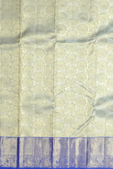 Off-White Kanchipuram Silk Saree with Floral Jacquard and Blue Border – Ethereal Elegance in Every Thread