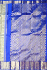 Off-White Kanchipuram Silk Saree with Floral Jacquard and Blue Border – Ethereal Elegance in Every Thread