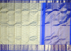 Off-White Kanchipuram Silk Saree with Floral Jacquard and Blue Border – Ethereal Elegance in Every Thread