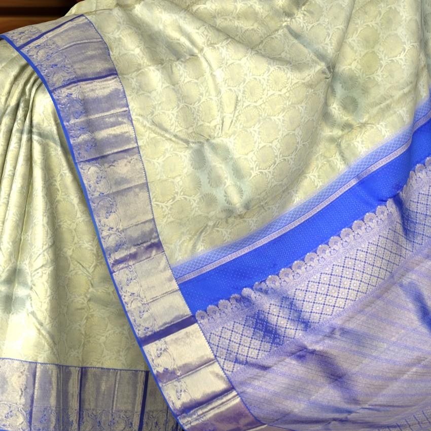 Off-White Kanchipuram Silk Saree with Floral Jacquard and Blue Border – Ethereal Elegance in Every Thread