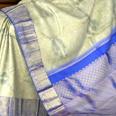 Off-White Kanchipuram Silk Saree with Floral Jacquard and Blue Border – Ethereal Elegance in Every Thread