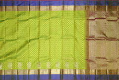 Light Green Jacquard Kanchipuram Silk Saree with Blue Motif Border – A Refreshing Blend of Grace and Tradition