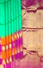 Sea Green Kanchipuram Silk Saree with Pink-Orange Zigzag Border and Triangle Motif Checks – A Vibrant Celebration in Silk