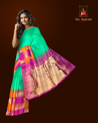 Sea Green Kanchipuram Silk Saree with Pink-Orange Zigzag Border and Triangle Motif Checks – A Vibrant Celebration in Silk