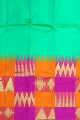 Sea Green Kanchipuram Silk Saree with Pink-Orange Zigzag Border and Triangle Motif Checks – A Vibrant Celebration in Silk