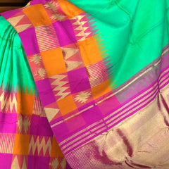 Sea Green Kanchipuram Silk Saree with Pink-Orange Zigzag Border and Triangle Motif Checks – A Vibrant Celebration in Silk
