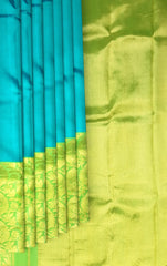 Turquoise Blue Kanchipuram Silk Saree with Long Floral Border – A Serene Drape of Subtle Splendor