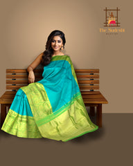 Turquoise Blue Kanchipuram Silk Saree with Long Floral Border – A Serene Drape of Subtle Splendor