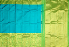 Turquoise Blue Kanchipuram Silk Saree with Long Floral Border – A Serene Drape of Subtle Splendor