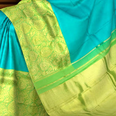 Turquoise Blue Kanchipuram Silk Saree with Long Floral Border – A Serene Drape of Subtle Splendor