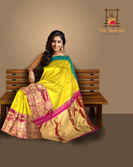Ochre Yellow Kanchipuram Silk Saree with Ganga Jamuna Pink-Blue Border – A Vivid Contrast of Cultural Grandeur