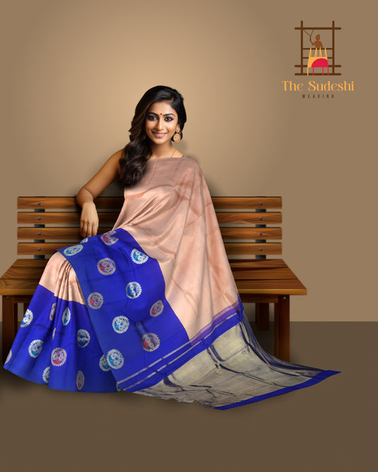 Light Pink Kanchi Pure Silk Saree with Royal Blue Border and Silver-Gold Circle Bhuttas – Subtle Elegance with a Regal Edge