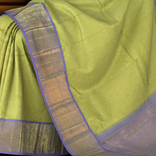 Lime Green Kanchipuram jacquard Silk Saree with embossed diamond design on the body with lavender contrast border and pallu