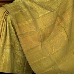 Biege Kanchipuram Silk Saree with jacquard, tissue, and diamond butta designs on the body with self annam, elephant, varusai pet border, and yanapet designs and benarspet designs in pallu