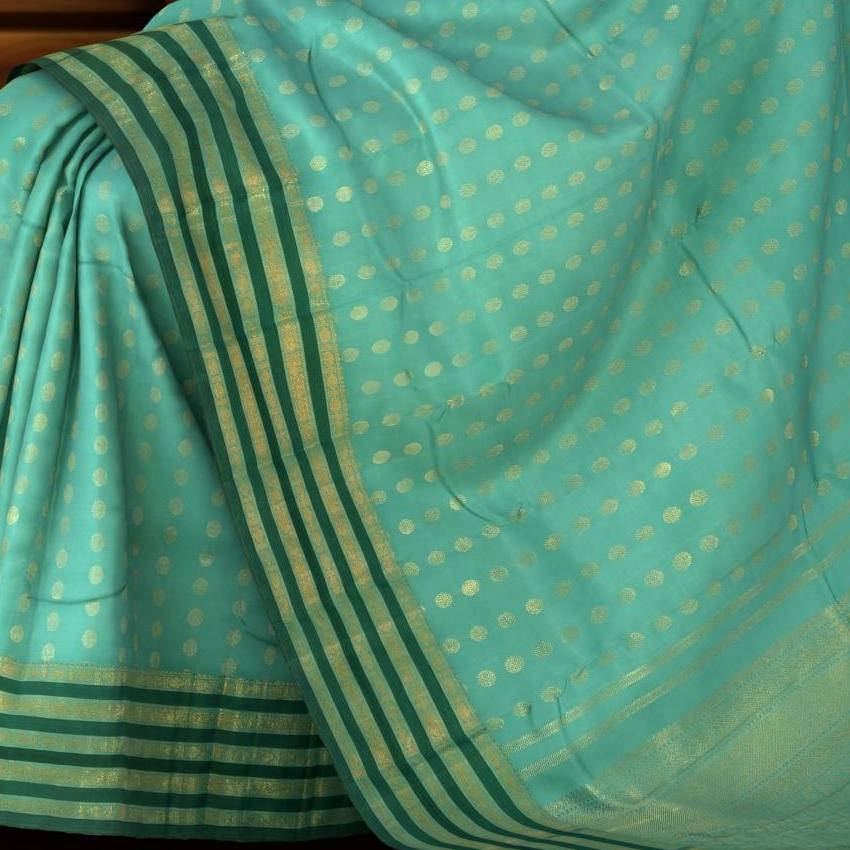 Light Green Kanchipuram Silk Saree with vertical rudraksham design on the body with dark green contrast border and annam, leaf, benarspet designs in pallu