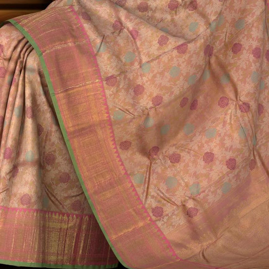 Light Baby Pink Kanchipuram Silk Saree with floral, embossed, and meenakari designs on the body with candy pink with green selvage contrast border and tear shaped motif with diamond design in pallu