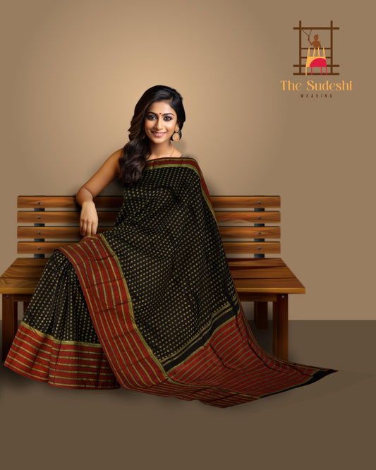 Black Kanchipuram Silk Saree with vertical chakram butta, brocade design on the body with red contrast border and rope design with red threadwork pallu