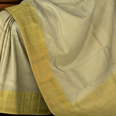 Gold Kanchipuram Silk Saree with Jacquard, diamond butta all over, with Brocade on the body with pale yellow contrast border and pallu featuring grand leaf design intricately designed
