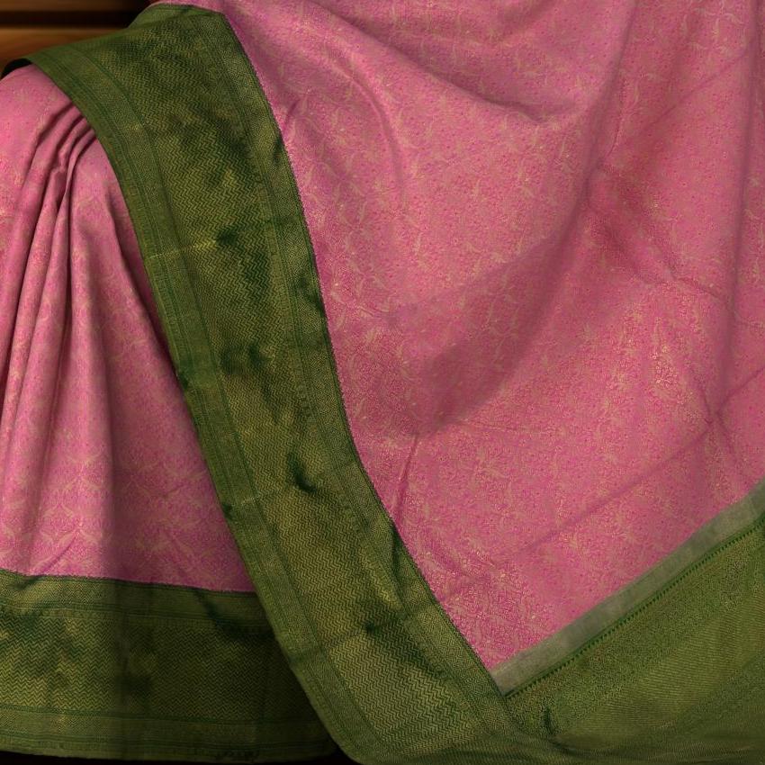 Pink Kanchipuram Silk Saree with Tissue, Embossed, Brocade on the body with bottle green contrast border and pallu featuring gene intricately designed diamond butta