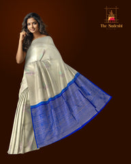 Elegant Beige Kanchipuram Silk Saree with Majestic Peacock Threadwork