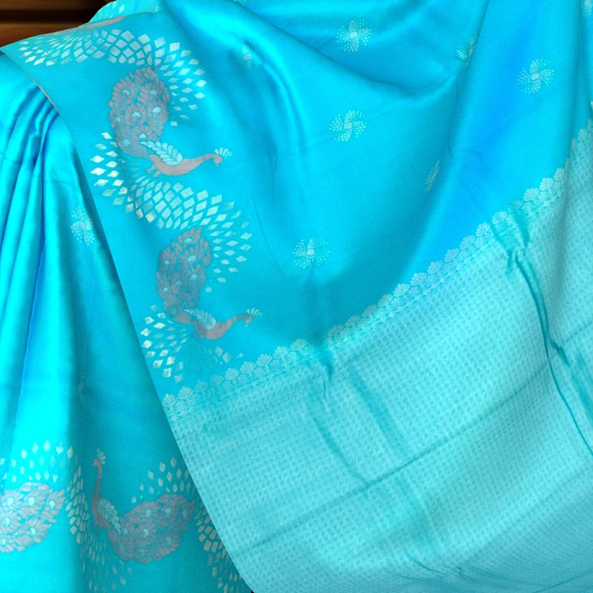 Enchanting Sky Blue Kanchipuram Silk Saree with One-Side Border and Peacock Motifs