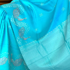 Enchanting Sky Blue Kanchipuram Silk Saree with One-Side Border and Peacock Motifs
