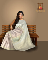 Offwhite Kanchipuram Silk Saree with Meenakari Floral Border and Tear-Shaped Bhuttas