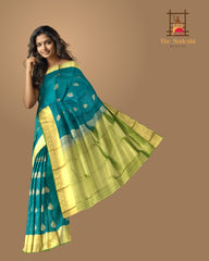Peacock Green Kanchipuram Silk Saree with Self Green Border and Tear-Shaped Buttas