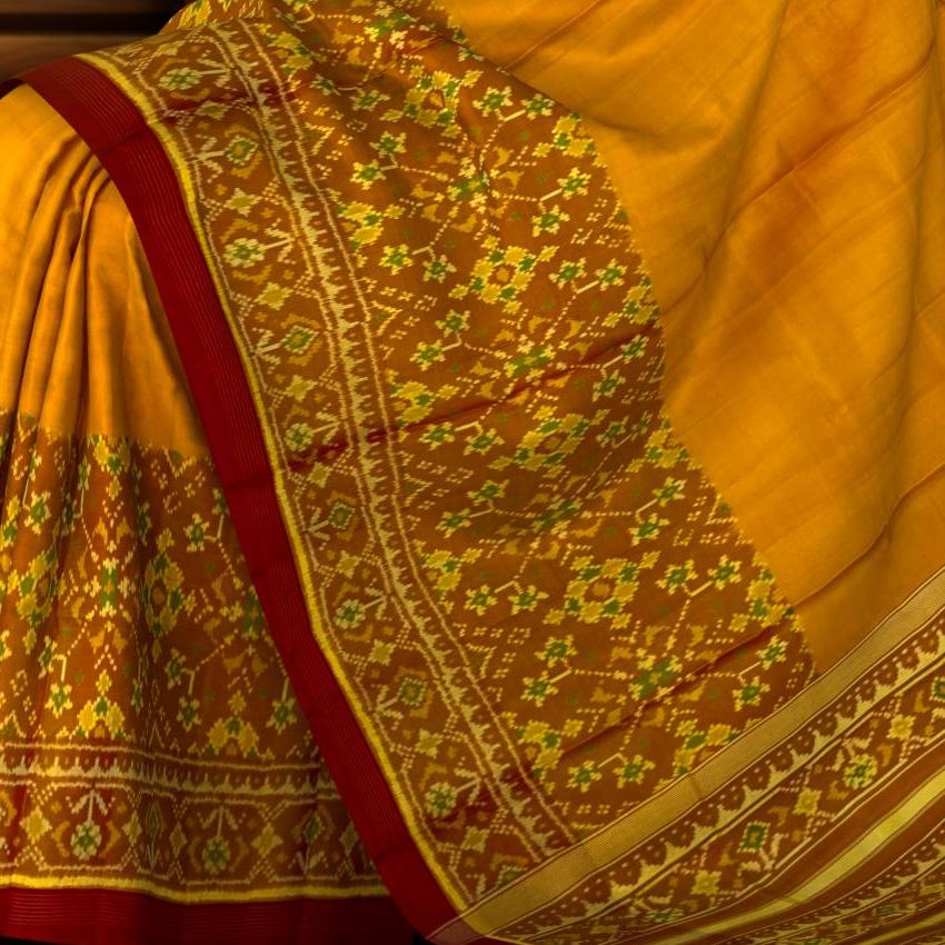 Rust Yellow Skirt Navratna Patola Saree