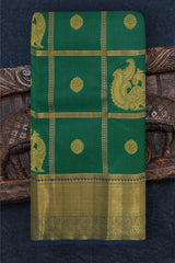 Green Kanchipuram Silk Saree with Annam checks on the body with Blue contrast border and Blue Grand Peacock Motif Pallu with Diamond Design