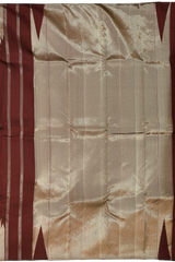 Maroon Kanchipuram Silk Saree with temple border on the body with Maroon self border and Maroon Grand Tissue Pallu