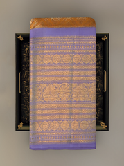 Light Orange Kanchipuram Silk Saree with large diamond motif design on the body with lavender contrast border featuring varusai pet border and annam, small diamond designs in pallu