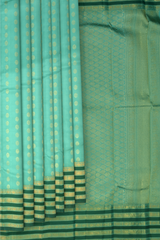 Light Green Kanchipuram Silk Saree with vertical rudraksham design on the body with dark green contrast border and annam, leaf, benarspet designs in pallu